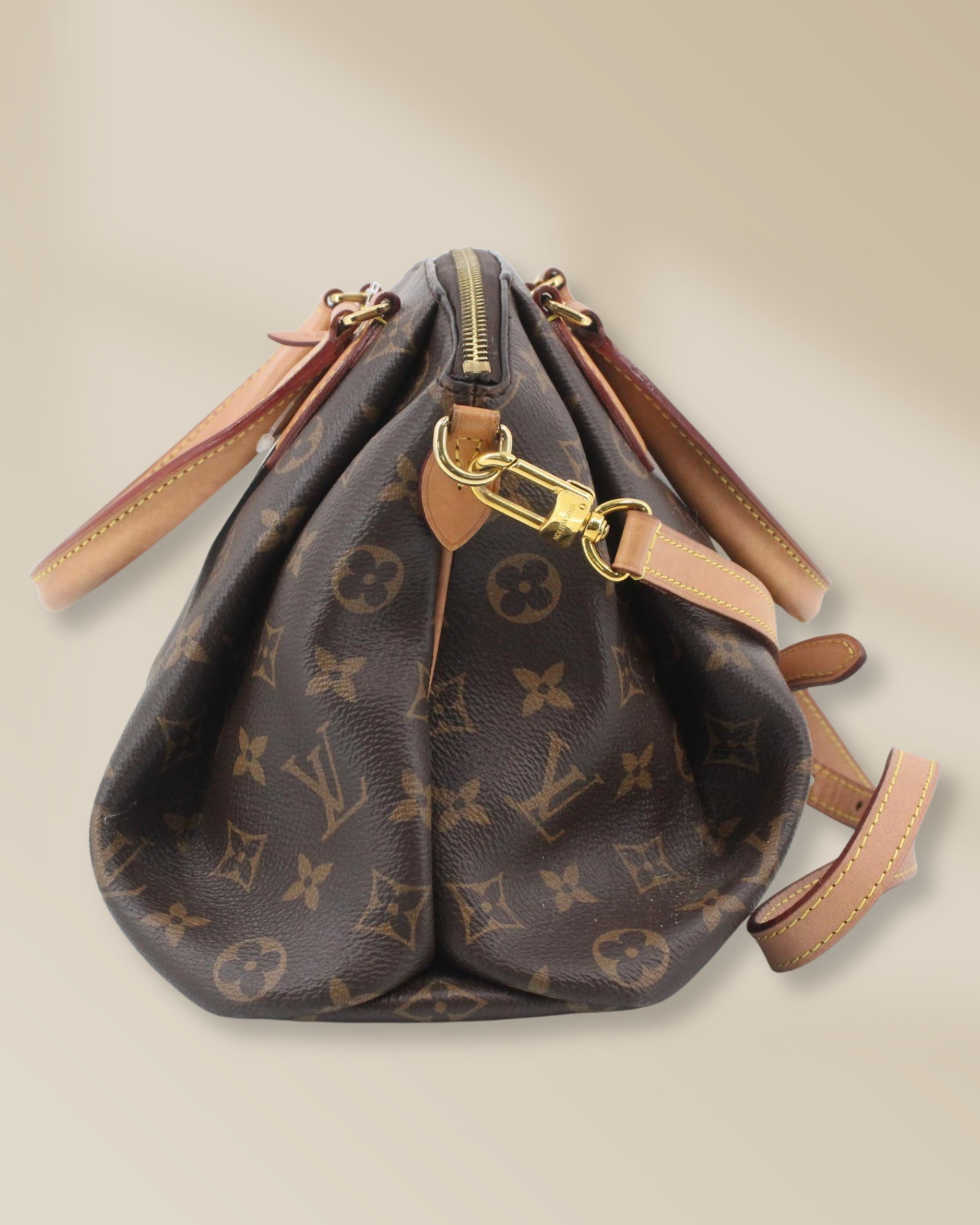 Tweedehands Louis Vuitton Rivoli PM Monogram handtas zijaanzicht